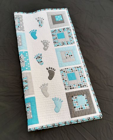 Small Steps folded quilt
